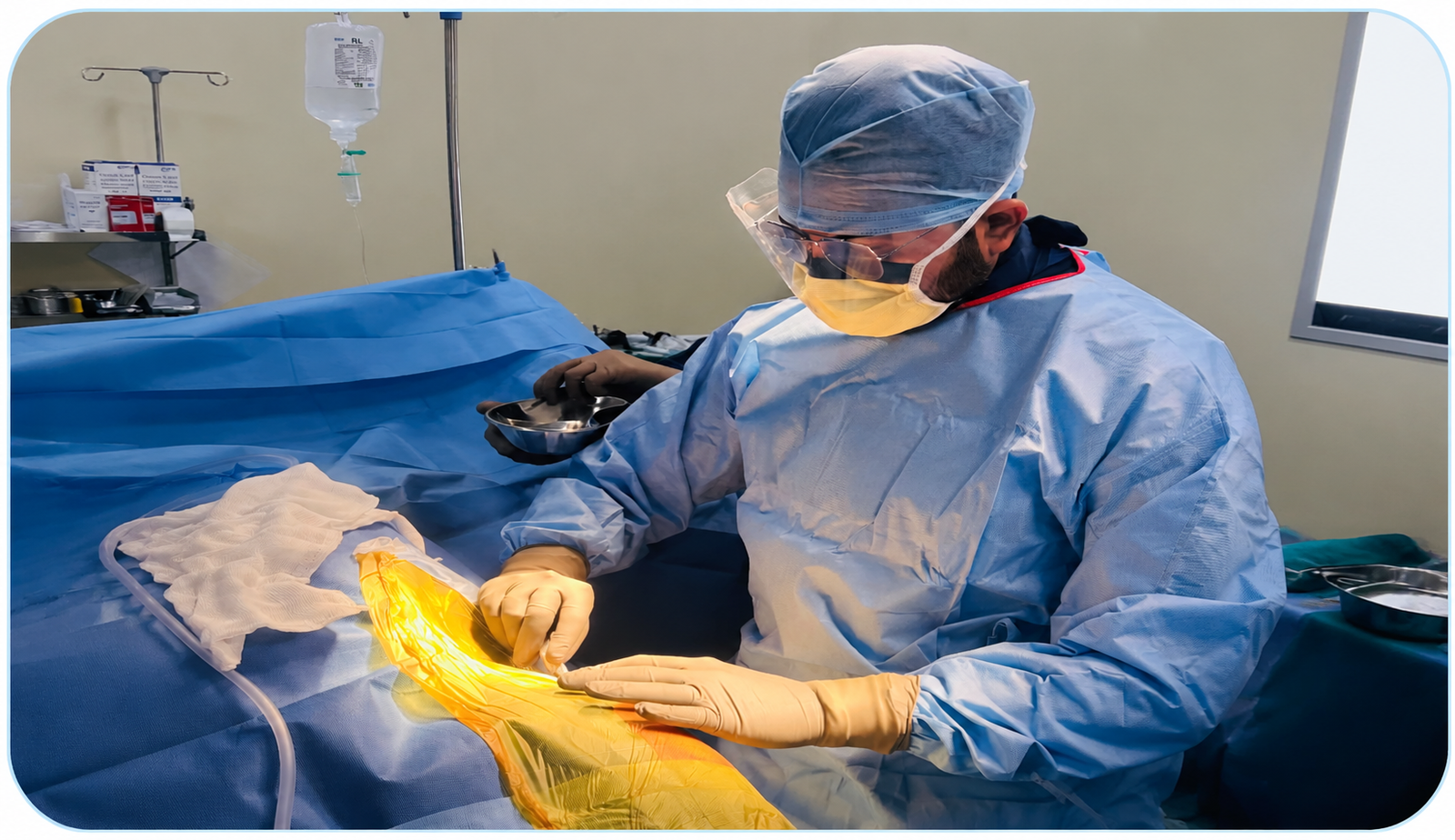 ChatGPT Image Aug 4, 2026, 08_14_56 PM Surgeon in sterile blue gown, mask, and goggles performing surgery with gloved hands on a patient draped in blue sterile sheet.